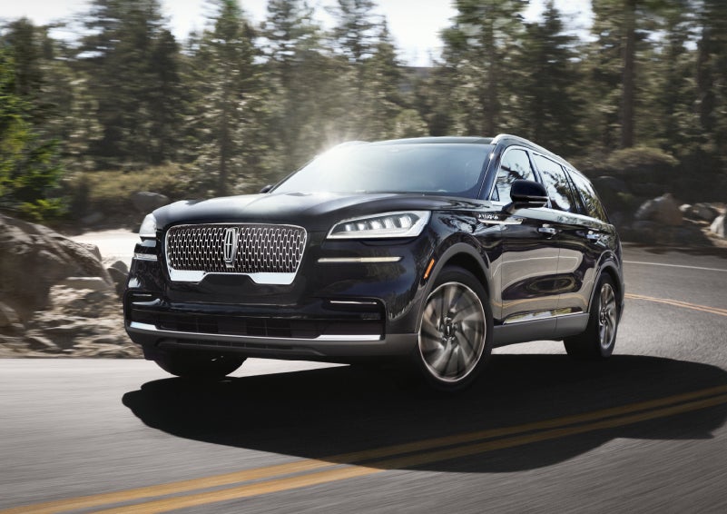 A Lincoln Aviator® SUV is being driven on a winding mountain road | Maguire's Lincoln in Palmyra PA