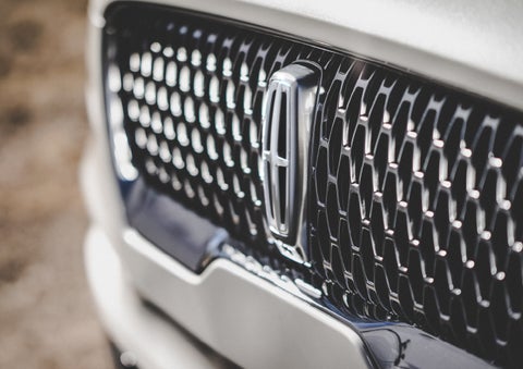 The grille of the 2024 Lincoln Aviator® Reserve model with an eye-catching repeated field of Lincoln Star logo shapes | Maguire's Lincoln in Palmyra PA