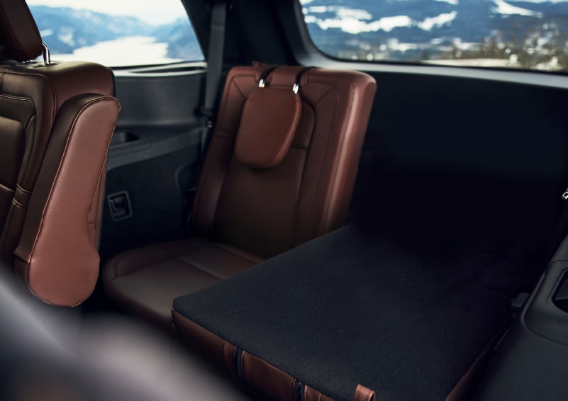 The left rear seat of a 2024 Lincoln Aviator® SUV is shown folded flat for additional cargo space | Maguire's Lincoln in Palmyra PA