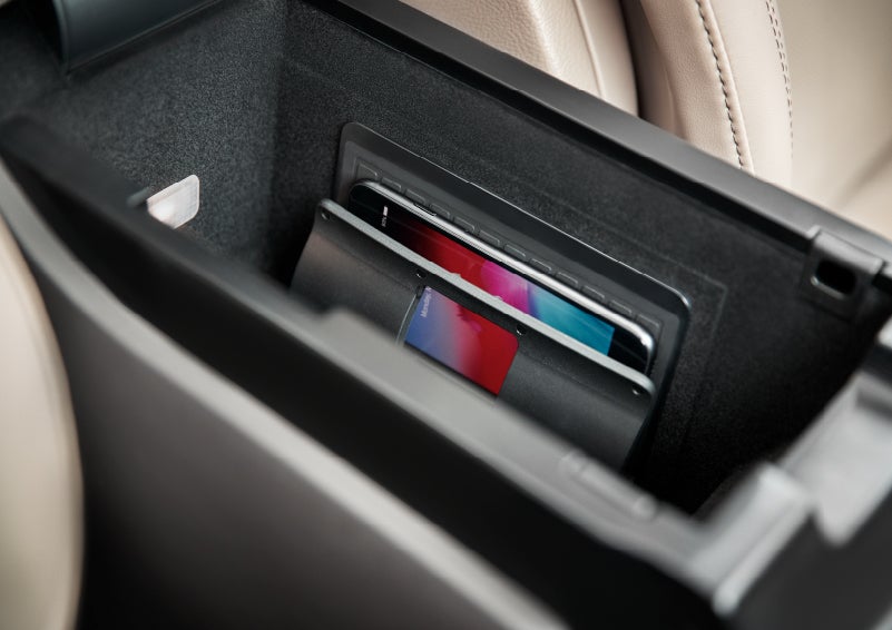 A smartphone device is securely tucked into the available wireless charging pad for an effortless energy boost | Maguire's Lincoln in Palmyra PA
