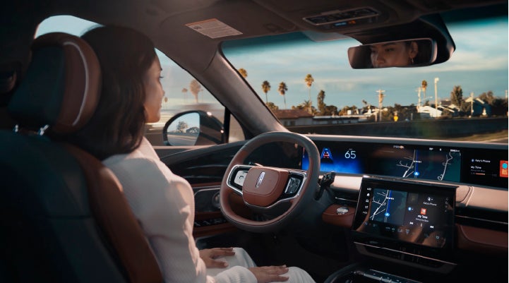 A person is shown driving hands-free on the highway with available Lincoln BlueCruise technology. | Maguire's Lincoln in Palmyra PA