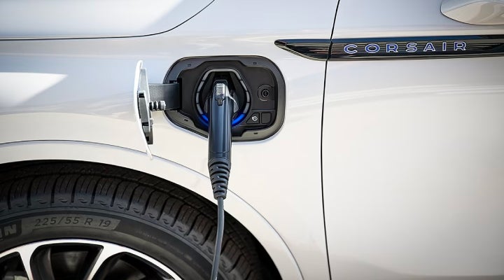 An electric charger is shown plugged into the charging port of a Lincoln Corsair® Grand Touring
model. | Maguire's Lincoln in Palmyra PA