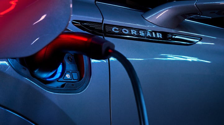 A charger plugged into the charging port of a 2024 Lincoln Corsair® Plug-in Hybrid model. | Maguire's Lincoln in Palmyra PA